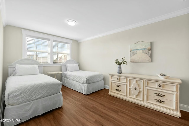 bedroom with crown molding and dark wood-type flooring