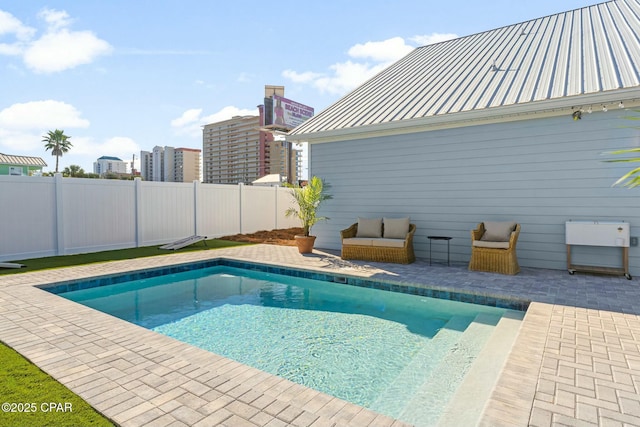 view of pool featuring a patio area