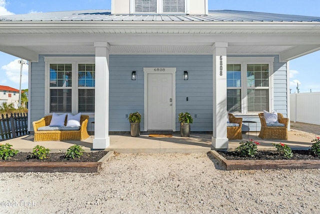 doorway to property with covered porch