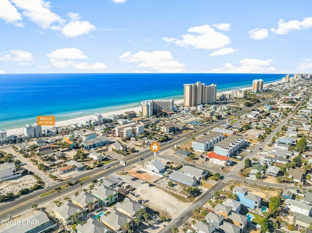 drone / aerial view featuring a view of the beach and a water view