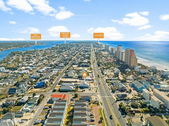 bird's eye view featuring a beach view and a water view