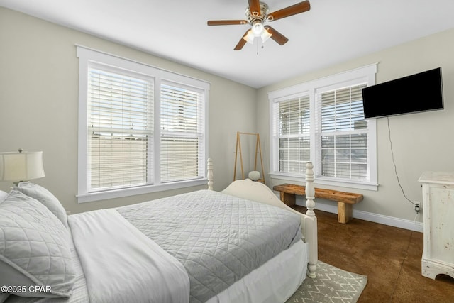 carpeted bedroom featuring multiple windows and ceiling fan