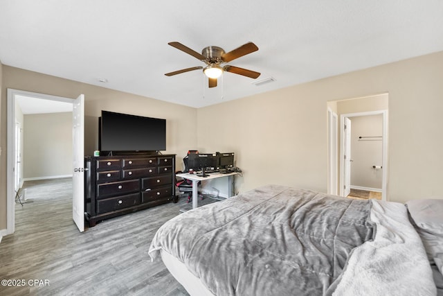 bedroom featuring ceiling fan and light hardwood / wood-style flooring