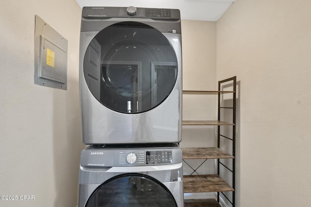 laundry area featuring stacked washer and clothes dryer