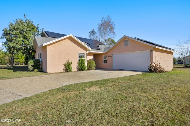 single story home featuring solar panels, a garage, and a front lawn