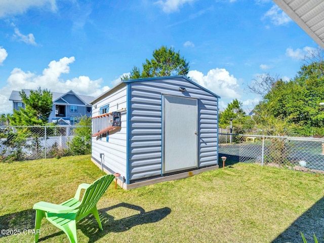 view of outbuilding featuring a yard