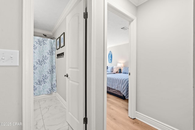 bathroom featuring ornamental molding