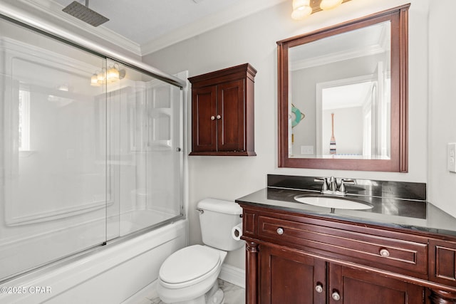 full bathroom with vanity, toilet, crown molding, and enclosed tub / shower combo