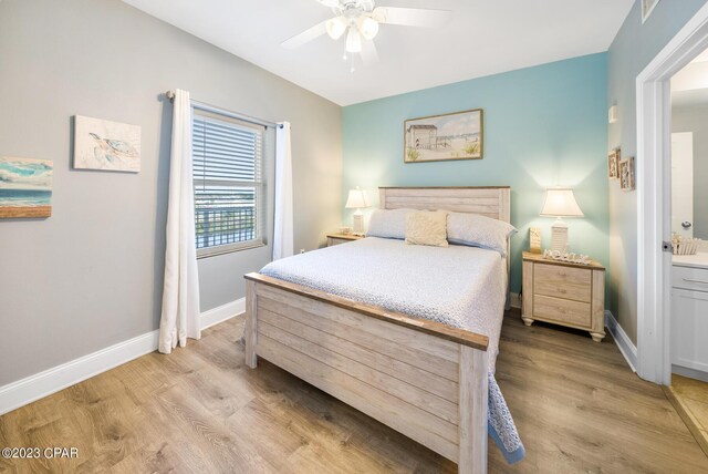 bedroom with ceiling fan and light hardwood / wood-style flooring