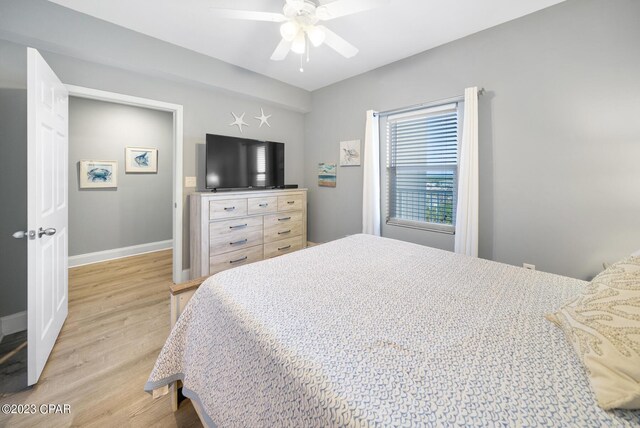 bedroom with ceiling fan and light wood-type flooring