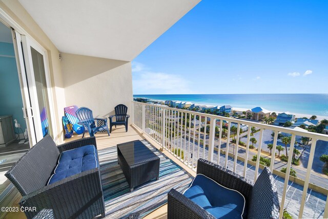 balcony featuring a water view