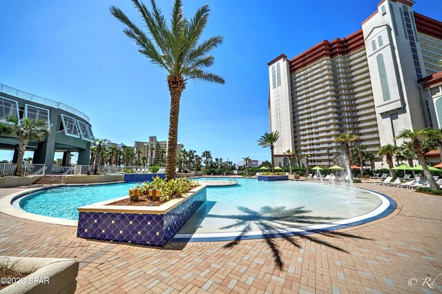 view of pool with pool water feature