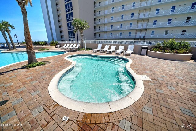 view of swimming pool featuring a patio area