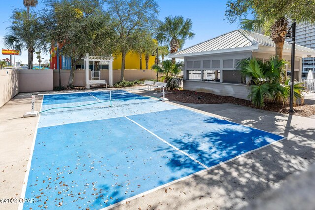 view of swimming pool with a pergola and tennis court