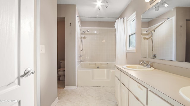 full bathroom with vanity, toilet, and shower / bath combo with shower curtain