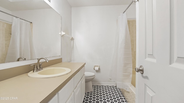 bathroom with vanity, toilet, and walk in shower