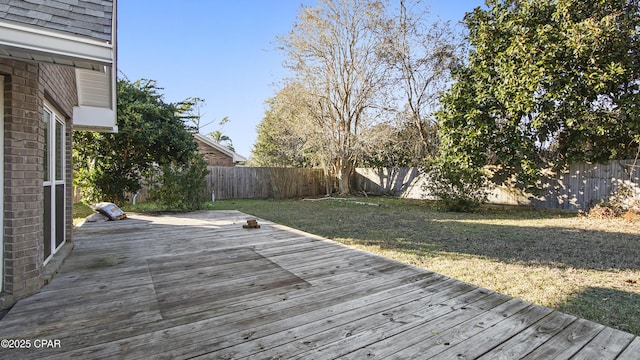 wooden terrace with a lawn