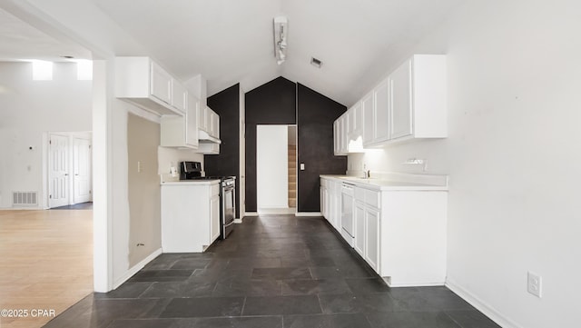 kitchen featuring dishwasher, white cabinets, lofted ceiling, and range