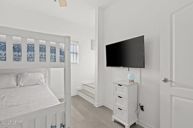 bedroom featuring ceiling fan and light hardwood / wood-style flooring