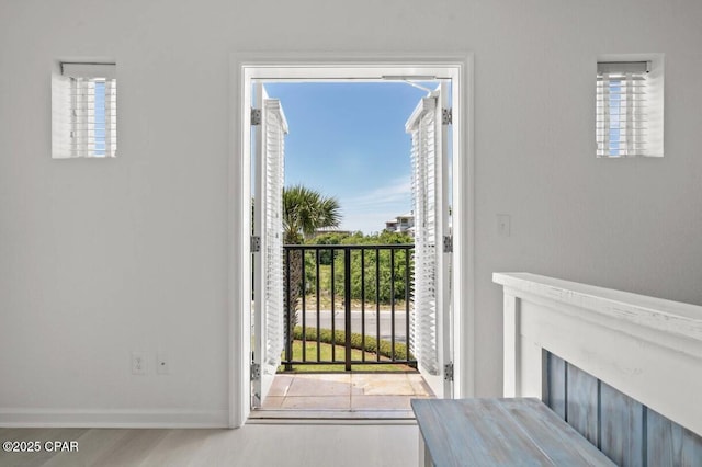 entryway featuring plenty of natural light and light wood-type flooring