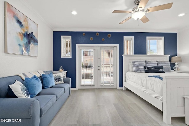 bedroom with multiple windows, french doors, access to outside, and ceiling fan