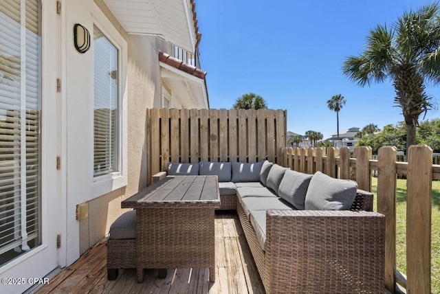 wooden balcony with outdoor lounge area and a deck