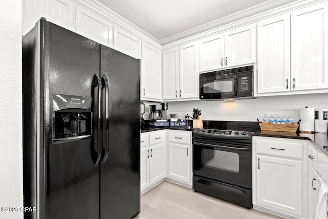 kitchen with white cabinets and black appliances