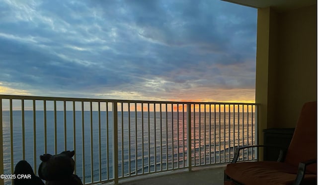 balcony at dusk with a water view