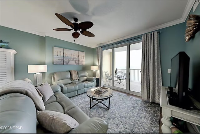 living room with hardwood / wood-style floors, crown molding, and ceiling fan