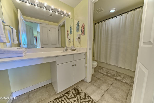 full bathroom with tile patterned floors, vanity, toilet, and shower / tub combo with curtain