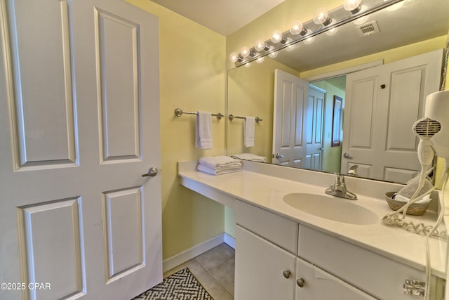 bathroom with vanity and tile patterned floors