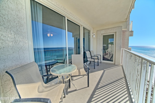 balcony featuring a water view