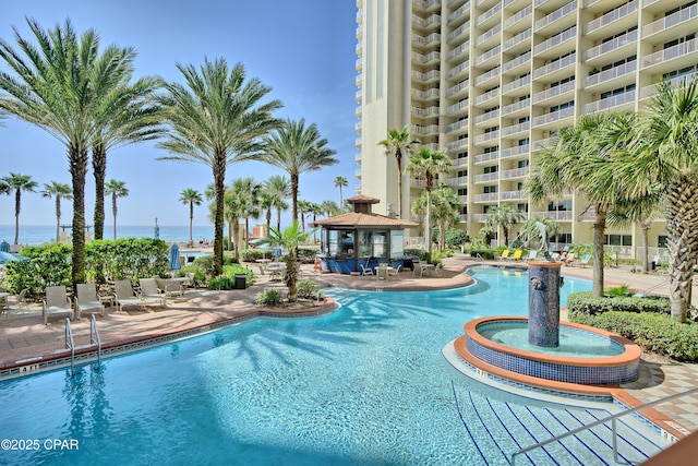 view of pool with a water view