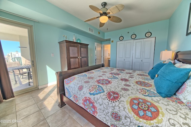 bedroom featuring access to outside, light tile patterned floors, a closet, a ceiling fan, and visible vents