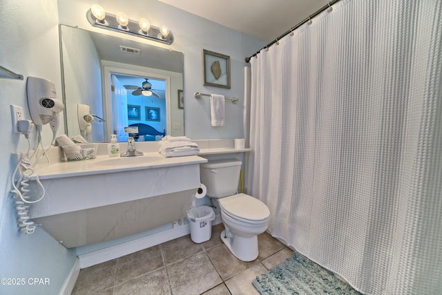 bathroom featuring tile patterned floors, a shower with curtain, sink, ceiling fan, and toilet