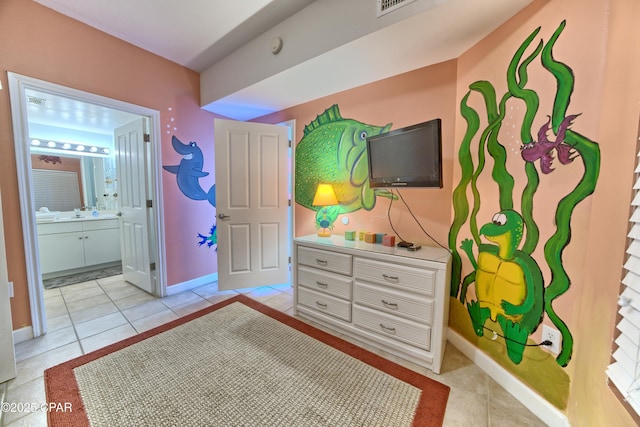 bedroom with light tile patterned floors, baseboards, and visible vents