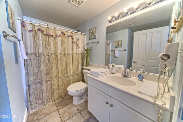 bathroom with tile patterned floors, vanity, toilet, and a shower with curtain