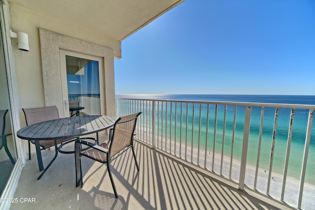 balcony with a view of the beach and a water view