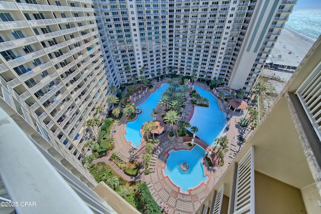 drone / aerial view with a water view and a beach view