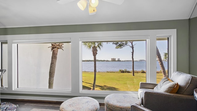 interior space featuring a water view, ceiling fan, and wood-type flooring