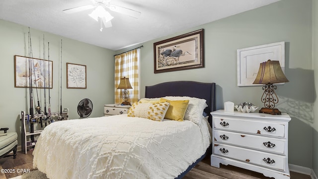 4271 Kingfish Ln Unit 271, Panama City Beach, FL 32408 - bedroom with dark wood finished floors and a ceiling fan