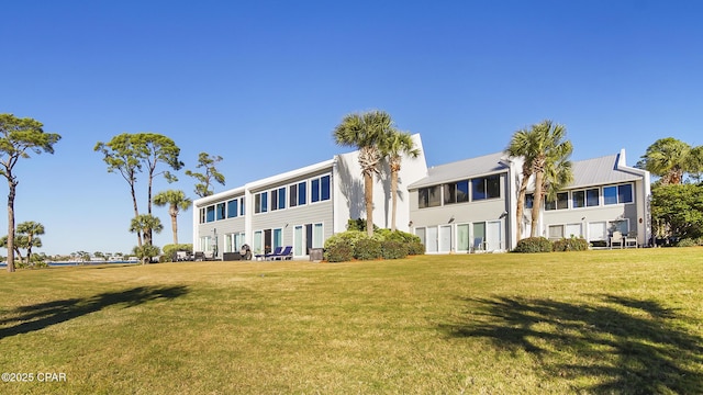 4271 Kingfish Ln Unit 271, Panama City Beach, FL 32408 - back of property featuring a lawn