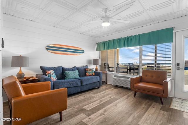 living room with hardwood / wood-style flooring and ceiling fan