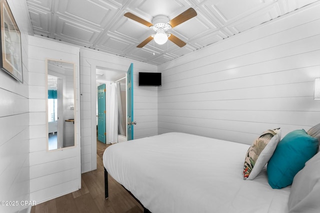 bedroom with dark wood-type flooring and ceiling fan