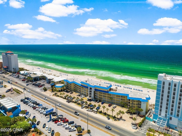 aerial view featuring a view of the beach and a water view