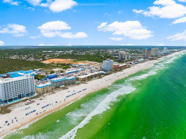 bird's eye view with a water view and a beach view