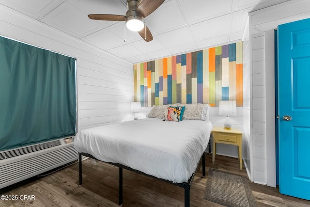 bedroom with ceiling fan and dark hardwood / wood-style flooring