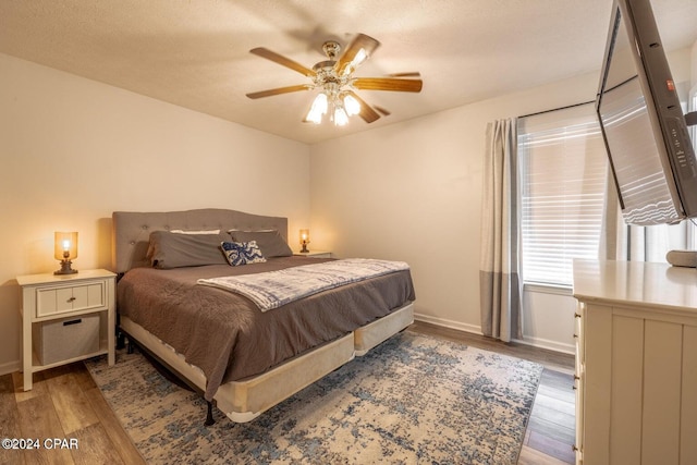 bedroom featuring hardwood / wood-style flooring and ceiling fan