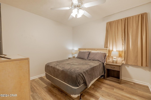 bedroom featuring ceiling fan and light hardwood / wood-style flooring