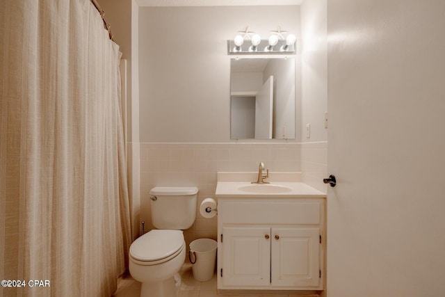 bathroom featuring vanity, tile patterned floors, a shower with shower curtain, toilet, and tile walls